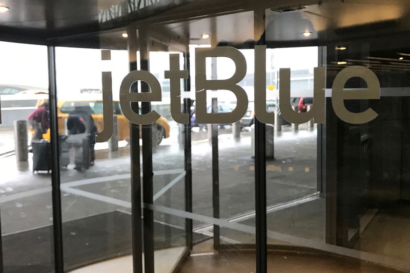 The JetBlue Airways logo is seen on a revolving door entering John F. Kennedy Airport in the Queens borough of New York U.S., January 24, 2017. REUTERS/Shannon Stapleton