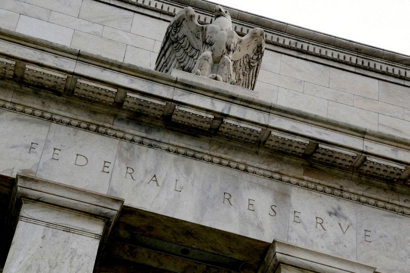 FILE PHOTO: An eagle tops the U.S. Federal Reserve building's facade in Washington, July 31, 2013. REUTERS/Jonathan Ernst/File Photo