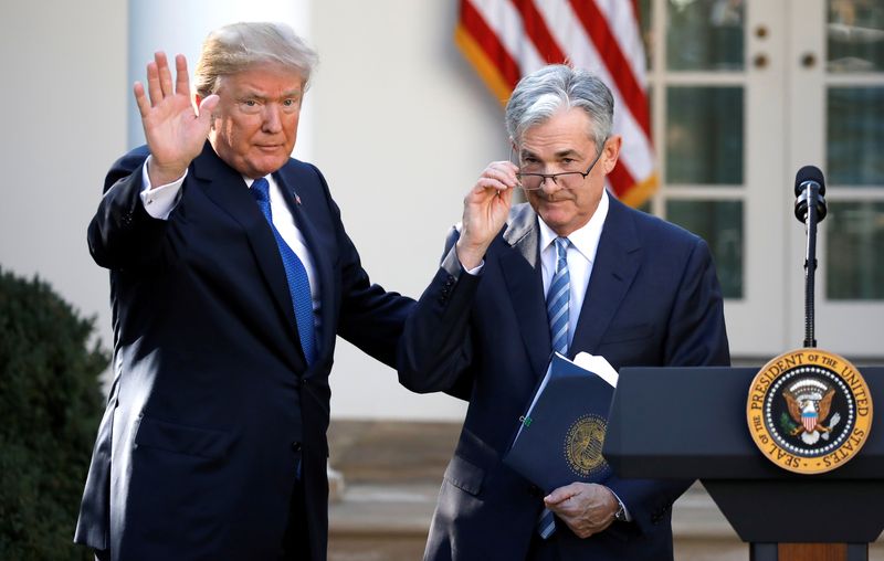 FILE PHOTO: U.S. President Donald Trump gestures with Jerome Powell, his nominee to become chairman of the U.S. Federal Reserve at the White House in Washington, U.S., November 2, 2017. REUTERS/Carlos Barria/File Photo