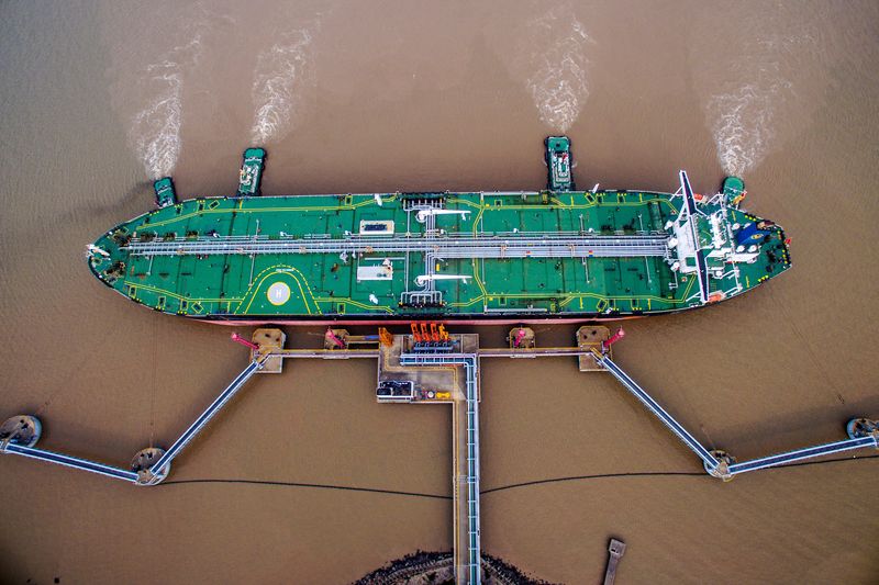 FILE PHOTO: An oil tanker unloads crude oil at a crude oil terminal in Zhoushan, Zhejiang province, China July 4, 2018. REUTERS/Stringer/File Photo