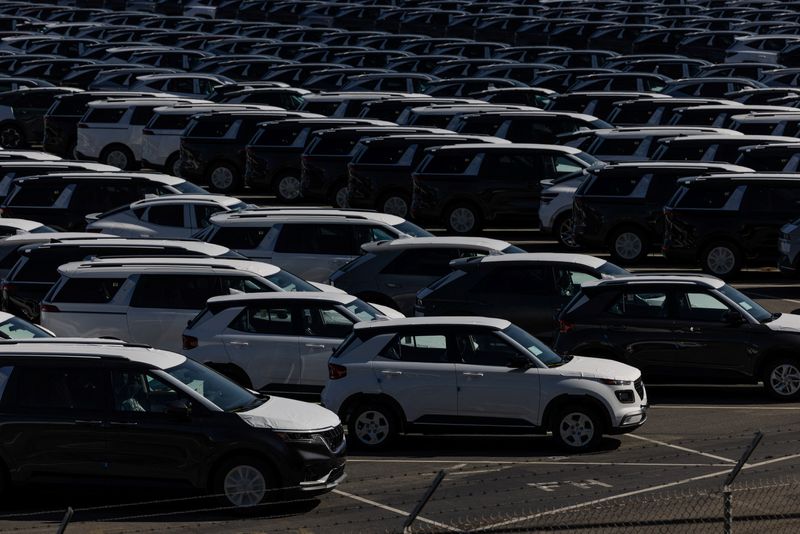 FILE PHOTO: New vehicles are seen at a parking lot in the Port of Richmond, at the bay of San Francisco, California June 8, 2023. REUTERS/Carlos Barria/File Photo