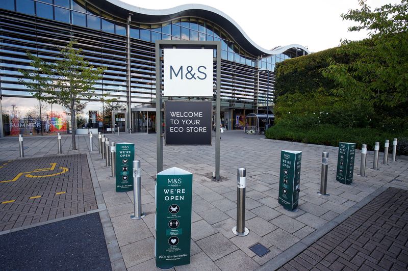FILE PHOTO: A Marks and Spencer (M&S) logo is seen on the outside of a store in Cheshire, Britain  August 18, 2020. REUTERS/Jason Cairnduff/File Photo