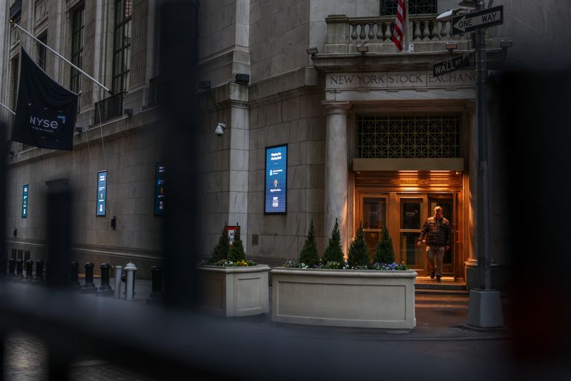 FILE PHOTO: A man exits the New York Stock Exchange (NYSE) onto Wall Street after the closing bell rings in New York City, U.S., April 7, 2025. REUTERS/Kylie Cooper/File Photo