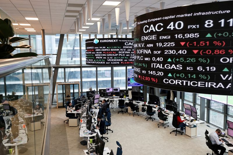 FILE PHOTO: People work at the trading floor of the Euronext stock exchange in the La Defense business district in Paris, France, March 10, 2025. REUTERS/Benoit Tessier/File Photo