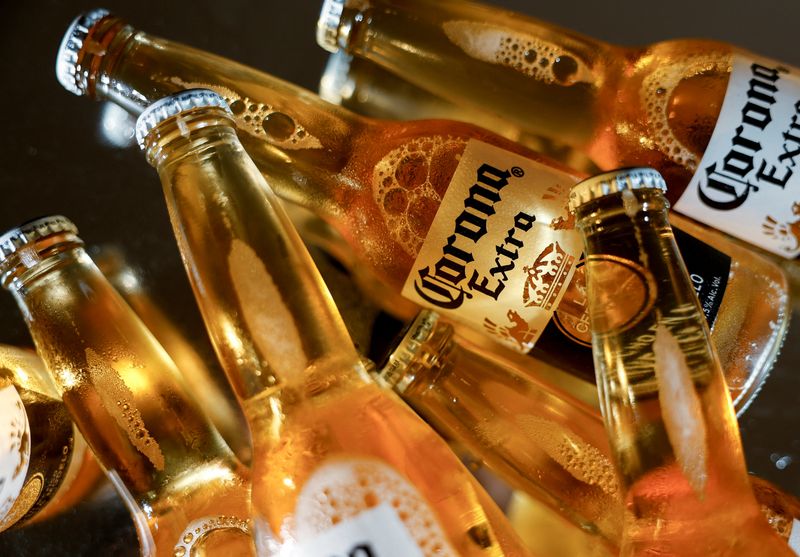 FILE PHOTO: Bottles of Corona beer, the flagship brand of Grupo Modelo are displayed in this illustration taken in Monterrey, Mexico, February 18, 2025. REUTERS/Daniel Becerril/ File Photo