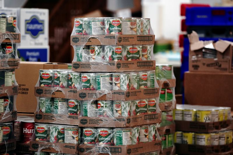 Del Monte canned tomatoes are seen among other nonperishable goods inside the West CAP Food Pantry in Boyceville, Wisconsin, U.S., October 22, 2020. Picture taken October 22, 2020. REUTERS/Bing Guan/File Photo