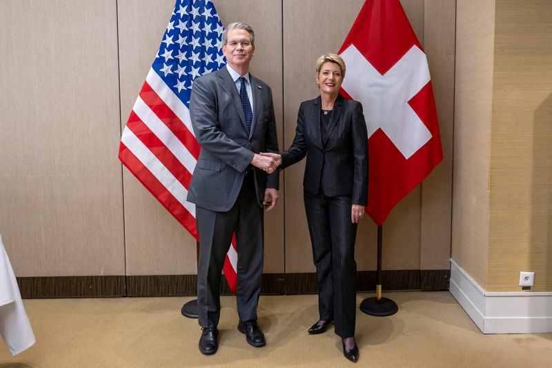 FILE PHOTO: U.S Secretary of the Treasury Scott Bessent shakes hands with Switzerland's President Karin Keller-Sutter during a bilateral meeting between Switzerland and the United States, in Geneva, Switzerland, May 9, 2025. Keystone/EDA/Martial Trezzini/Handout via REUTERS    THIS IMAGE HAS BEEN SUPPLIED BY A THIRD PARTY./File Photo