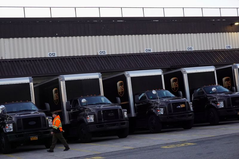 FILE PHOTO: United Parcel Service (UPS) vehicles are seen at a facility in Brooklyn, New York City, U.S., May 9, 2022. REUTERS/Andrew Kelly/File Photo