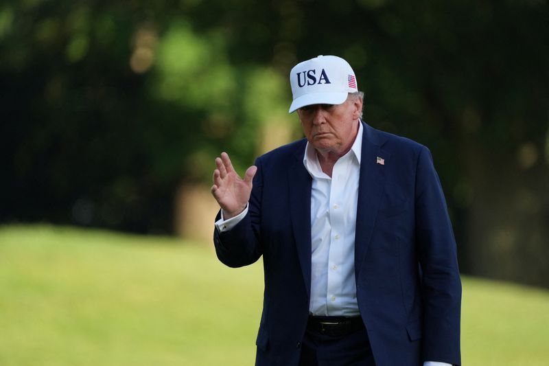 U.S. President Donald Trump gestures after disembarking Marine One as he arrives at the White House in Washington, D.C., U.S., July 6, 2025. REUTERS/Ken Cedeno/File Photo