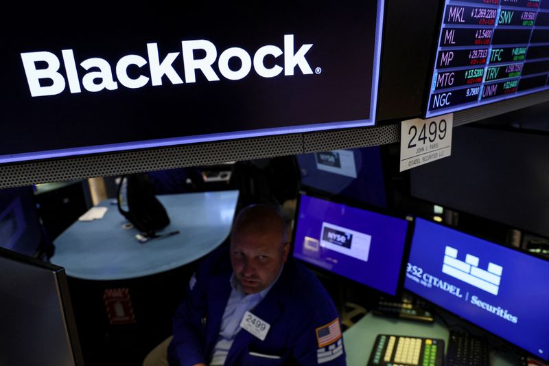 A specialist trader works at the post where BlackRock is traded on the floor of the New York Stock Exchange (NYSE) in New York City, U.S., July 21, 2022.  REUTERS/Brendan McDermid/File Photo