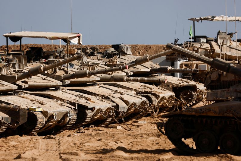 Israeli military vehicles stand near the Israel-Gaza border, in Israel July 7, 2025. REUTERS/Amir Cohen
