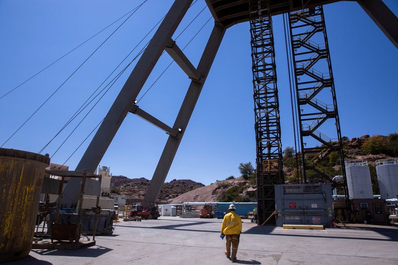 FILE PHOTO: A mine worker walks toward the mine shaft at the Resolution Copper exploratory mine shaft 10 facility in Superior, Arizona, U.S., March 30, 2021. Picture taken March 30, 2021.  REUTERS/Caitlin O'Hara/File Photo