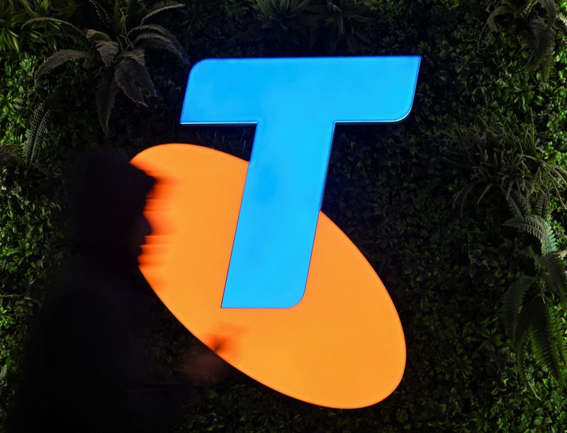 FILE PHOTO: A woman walks past a Telstra store in Sydney's CBD in Sydney, Australia, July 3, 2024. REUTERS/Jaimi Joy/File Photo
