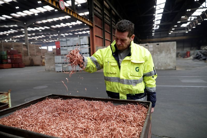 An employee holds copper chips at the Metallum Group metal recycling company in Regensdorf, Switzerland, October 25, 2017. REUTERS/Moritz Hager/File Photo