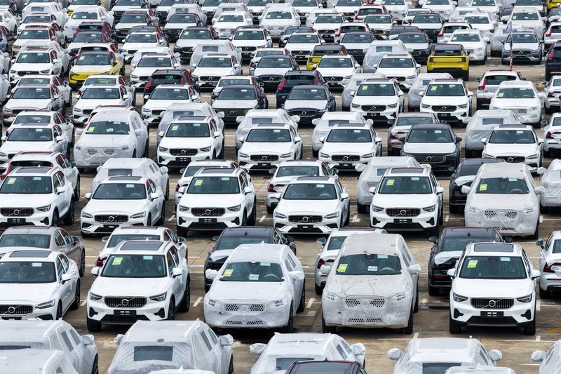 FILE PHOTO: A drone view shows cars for export sitting at a port in Nanjing, Jiangsu province, China June 9, 2025. cnsphoto via REUTERS/File Photo