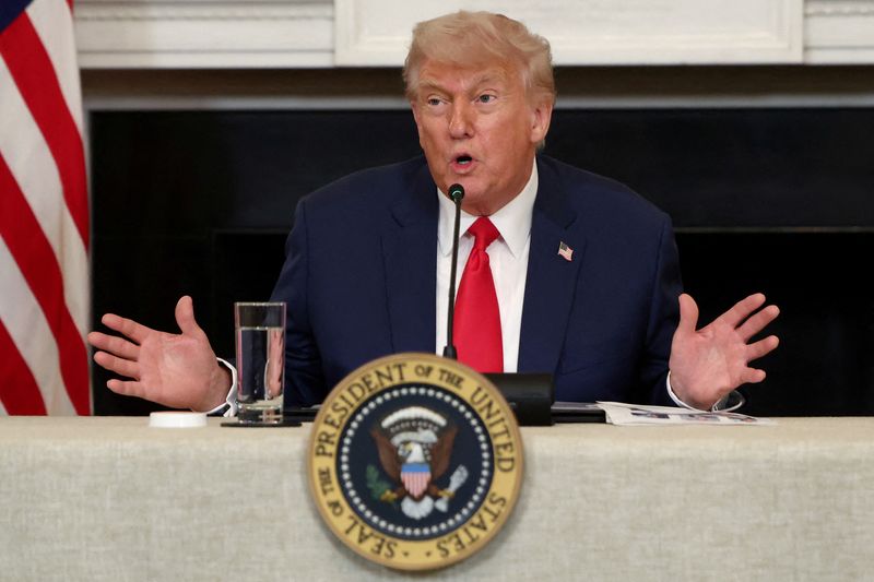 FILE PHOTO: U.S. President Donald Trump speaks during an Invest America Roundtable in the State Dining room, at the White House, in Washington, U.S., June 9, 2025. REUTERS/Evelyn Hockstein/File Photo