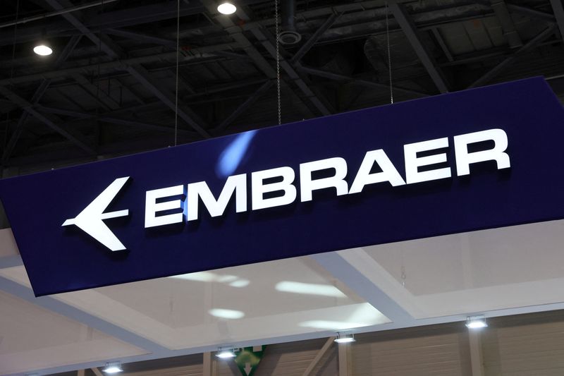 FILE PHOTO: An Embraer logo is pictured during the European Business Aviation Convention & Exhibition (EBACE) in Geneva, Switzerland, May 23, 2022. REUTERS/Denis Balibouse/File Photo