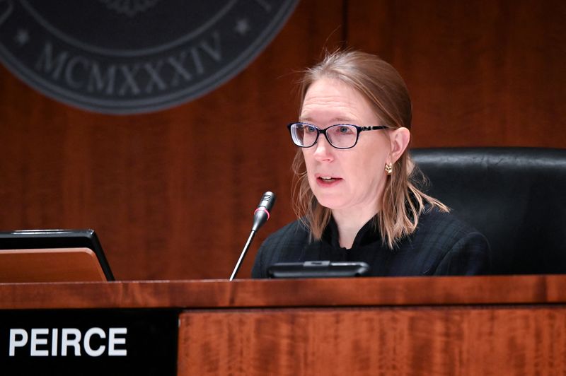 FILE PHOTO: Commissioner Hester Peirce participates in a U.S Securities and Exchange Commission open meeting in Washington, U.S., December 18, 2019. REUTERS/Erin Scott/File Photo