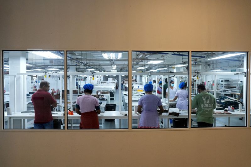 FILE PHOTO: Employees sew garments inside a garment factory in Katunayake on the outskirts of Colombo, Sri Lanka, April 3, 2025. REUTERS/Thilina Kaluthotage/File Photo
