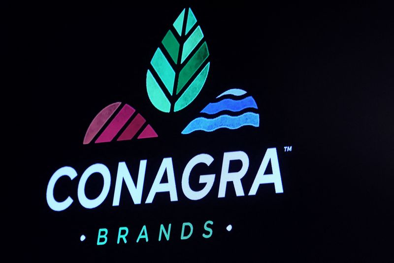 FILE PHOTO: The company logo for Conagra Brands Inc. is displayed on a screen on the floor of the New York Stock Exchange (NYSE) in New York City, U.S., April 10, 2023.  REUTERS/Brendan McDermid/File Photo
