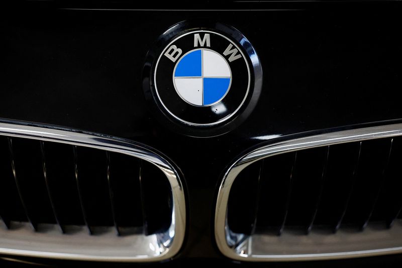 A logo of BMW is seen inside a car dealer in Nijmegen, Netherlands February 26, 2025. REUTERS/Piroschka van de Wouw