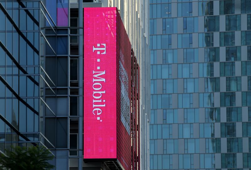 FILE PHOTO: A T-Mobile logo is advertised on a building sign in Los Angeles, California, U.S., May 11, 2017. REUTERS/Mike Blake/File Photo