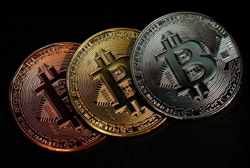 FILE PHOTO: Representations of the Bitcoin cryptocurrency are seen in this picture illustration taken June 7, 2021. REUTERS/Edgar Su/Illustration/File Photo