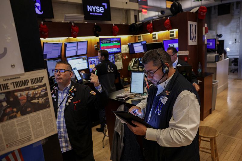 Traders work on the floor at the New York Stock Exchange (NYSE) in New York City, U.S., July 10, 2025. REUTERS/Jeenah Moon