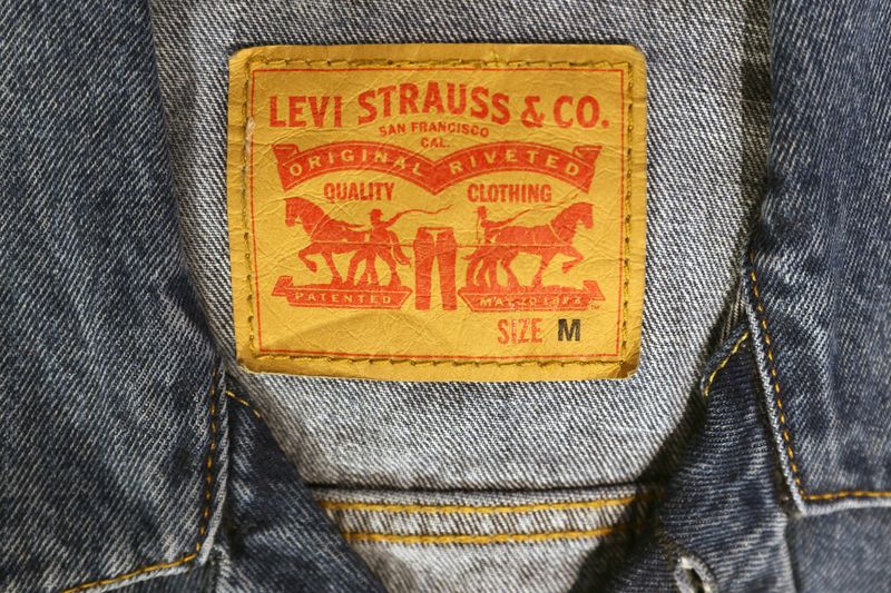 FILE PHOTO: The Levi Strauss & Co. label is seen on clothes in a store at the Woodbury Common Premium Outlets in Central Valley, New York, U.S., February 15, 2022. REUTERS/Andrew Kelly/ File Photo