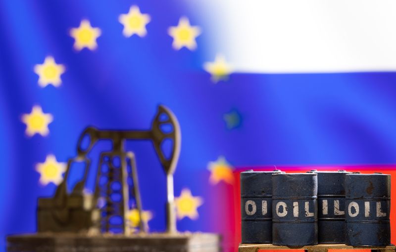 FILE PHOTO: Models of oil barrels and a pump jack are seen in front of displayed EU and Russia flag colours in this illustration taken March 8, 2022. REUTERS/Dado Ruvic/Illustration/ File Photo