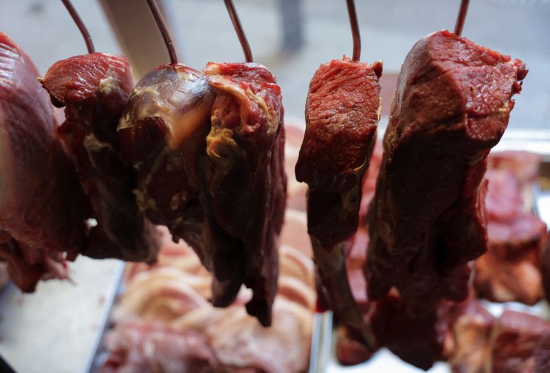FILE PHOTO: Pieces of meat hang at a butcher shop in Rio de Janeiro, Brazil November 26, 2024.  REUTERS/Ricardo Moraes/File Photo