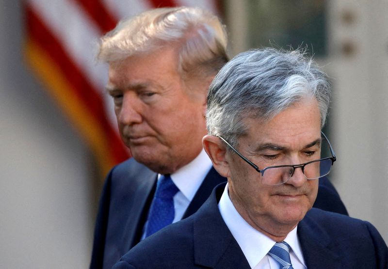 FILE PHOTO: U.S. President Donald Trump looks on as Jerome Powell, his nominee at the time to lead the U.S. Federal Reserve, moves to the podium at the White House in Washington, U.S., November 2, 2017. REUTERS/Carlos Barria/File Photo