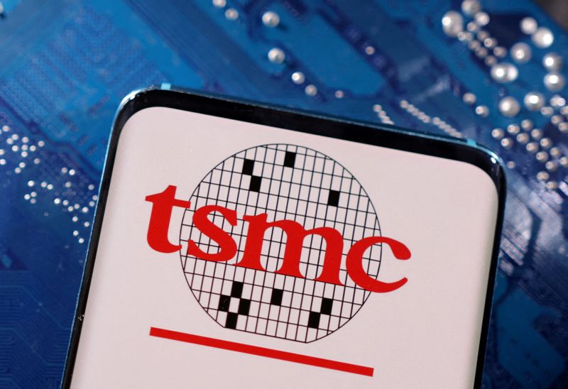 FILE PHOTO: A smartphone with a displayed TSMC (Taiwan Semiconductor Manufacturing Company)  logo is placed on a computer motherboard in this illustration taken March 6, 2023. REUTERS/Dado Ruvic/Illustration/File Photo