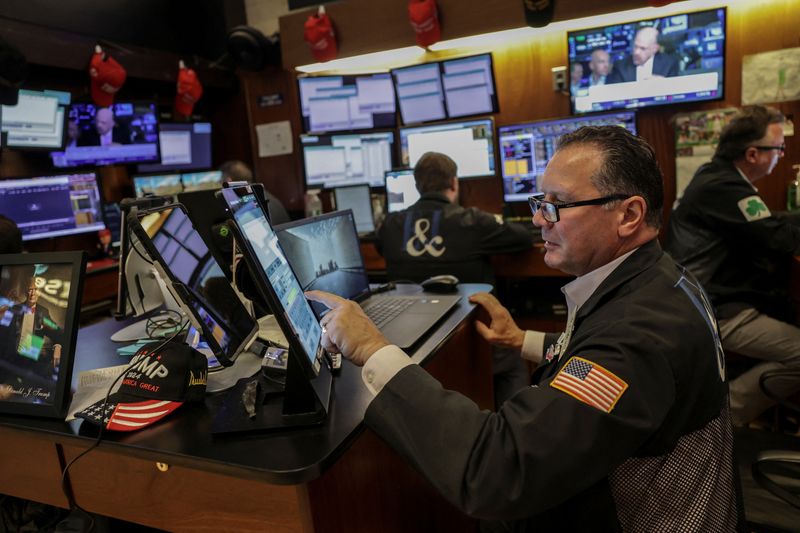 A trader works on the floor at the New York Stock Exchange (NYSE) in New York City, U.S., July 14, 2025. REUTERS/Jeenah Moon/File Photo