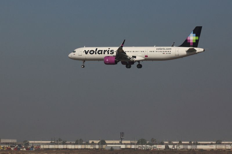 FILE PHOTO: A plane of the Mexican low-cost airline Volaris prepares for landing at the General Abelardo L. Rodriguez International Airport, in Tijuana, Mexico December 9, 2024. REUTERS/Jorge Duenes/File Photo