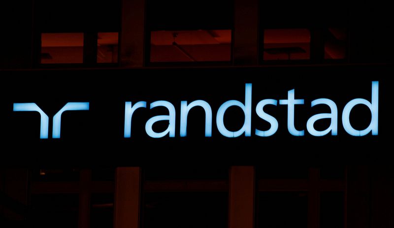 FILE PHOTO: The logo of personnel service provider Randstad is seen at an office building in Zurich, Switzerland October 2, 2018.  REUTERS/Arnd Wiegmann/File Photo