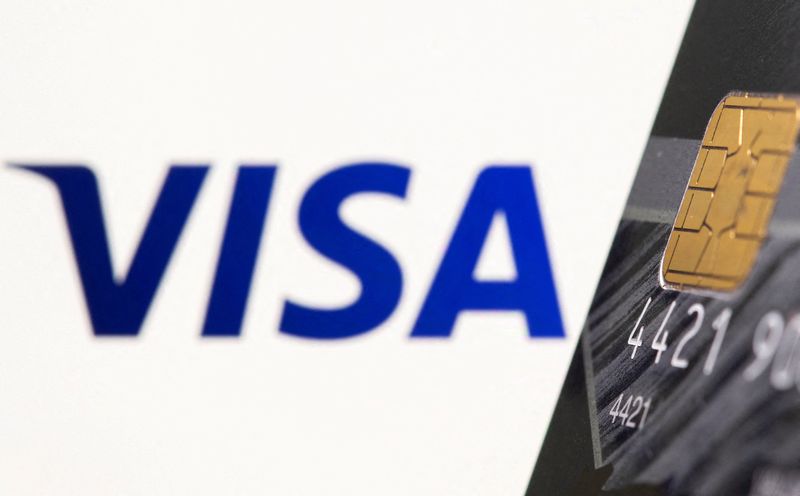 FILE PHOTO: Credit card is seen in front of displayed Visa logo in this illustration taken, July 15, 2021. REUTERS/Dado Ruvic/Illustration/File Photo