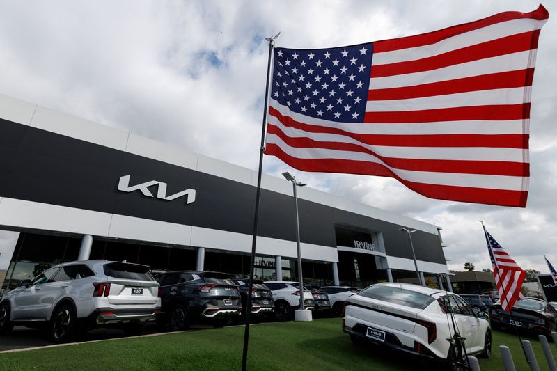 FILE PHOTO: Automobiles are shown for sale at a KIA car dealership in Irvine, California, U.S., March 27, 2025.  REUTERS/Mike Blake/ File Photo