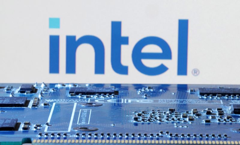 Intel logo is seen near computer motherboard in this illustration taken January 8, 2024. REUTERS/Dado Ruvic/Illustration/File Photo