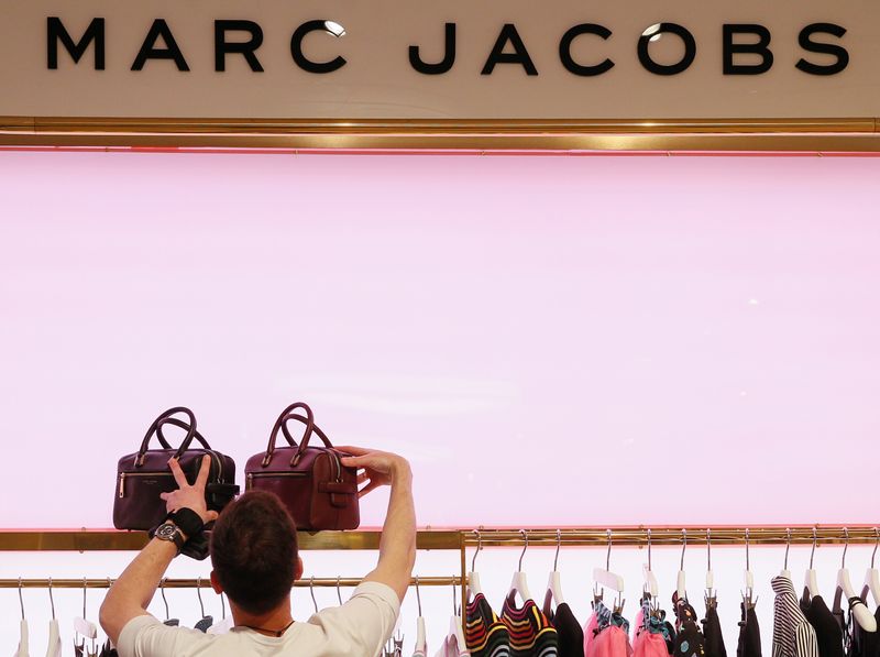 FILE PHOTO: An employee displays handbags in the Marc Jacobs section in the Central Universal Department Store (TsUM) in Kiev, Ukraine May 17, 2017. REUTERS/Valentyn Ogirenko/File Photo