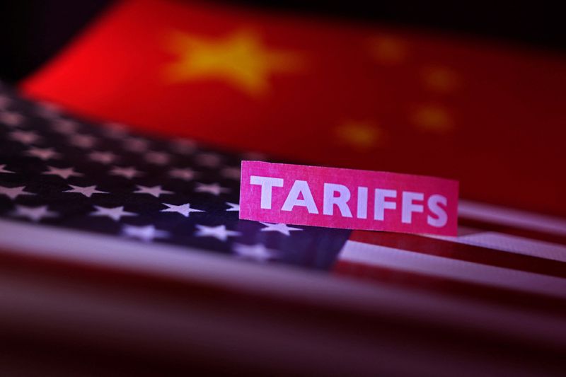 U.S. and Chinese flags and a "tariffs" label are seen in this illustration taken April 10, 2025. REUTERS/Dado Ruvic/Illustration