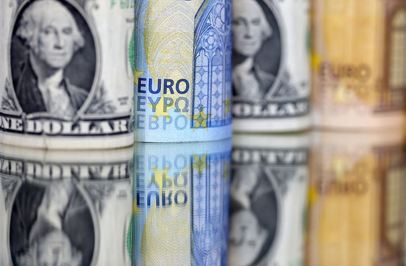 FILE PHOTO: U.S. Dollar and Euro banknotes are seen in this illustration taken July 17, 2022. REUTERS/Dado Ruvic/Illustration/File photo