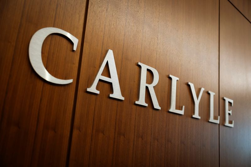 FILE PHOTO: Carlyle signage displays at the office in Manhattan in New York City, U.S., February 26, 2025. REUTERS/Jeenah Moon/File photo