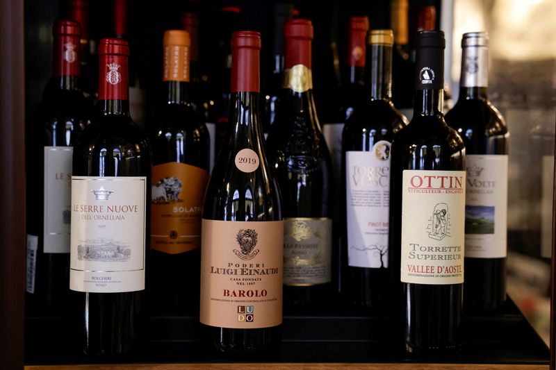 FILE PHOTO: Bottles of Italian wines are stored in a fridge inside the wine shop Kabb in Rome, Italy, March 14, 2025. REUTERS/Remo Casilli/File Photo