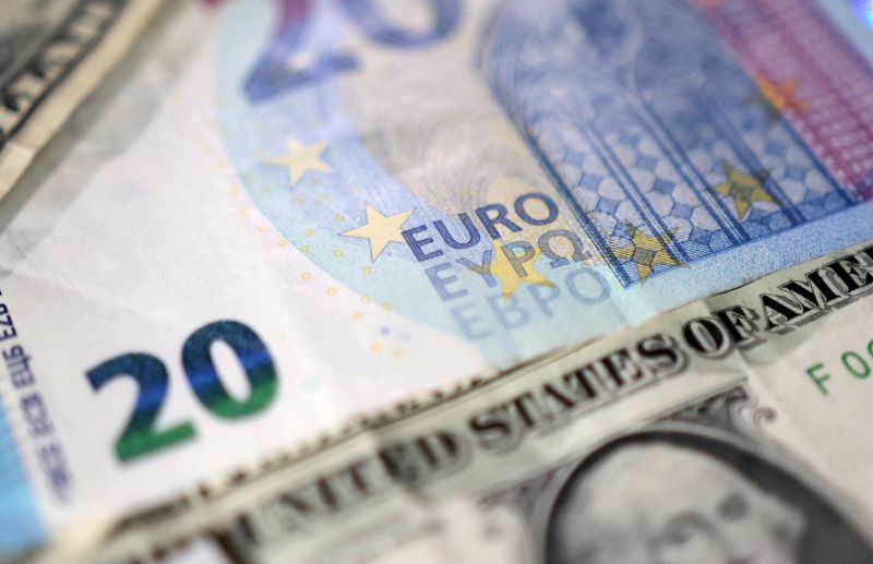 FILE PHOTO: Euro and U.S. dollar banknotes are seen in this illustration taken May 4, 2025. REUTERS/Dado Ruvic/Illustration/File Photo