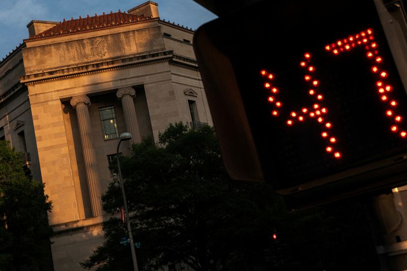 FILE PHOTO: The U.S. Department of Justice is seen in Washington, D.C., U.S., June 4, 2025. REUTERS/Nathan Howard/File Photo