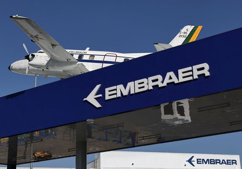 FILE PHOTO: An airplane adorns the roof at Embraer headquarters and aircraft factory in Sao Jose dos Campos, Brazil July 16, 2025. REUTERS/Roosevelt Cassio/File Photo