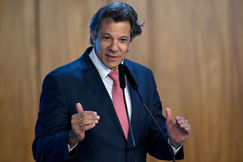 Brazil's Finance Minister Fernando Haddad addresses the audience during a sustainable mobility event, a day after U.S. President Donald Trump announced tariffs on imports from Brazil, in Brasilia, Brazil July 10, 2025. REUTERS/Mateus Bonomi/File Photo