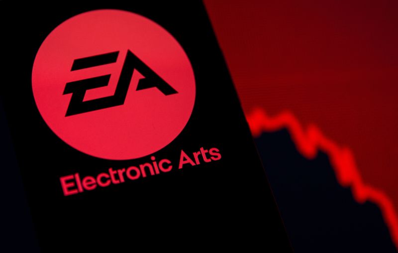 FILE PHOTO: A smartphone with the Electronic Arts logo is seen in front of a displayed stock graph in this illustration taken September 16, 2021. REUTERS/Dado Ruvic/Illustration/File Photo