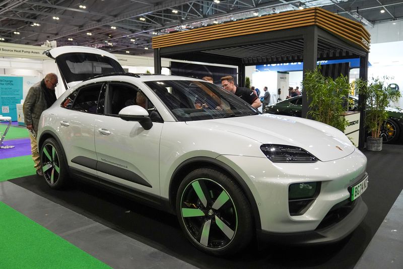 Porsche electric car is displayed at the Everything Electric, the Home Energy & Electric Vehicle Show, in London, Britain, April 16, 2025. REUTERS/Maja Smiejkowska/File Photo